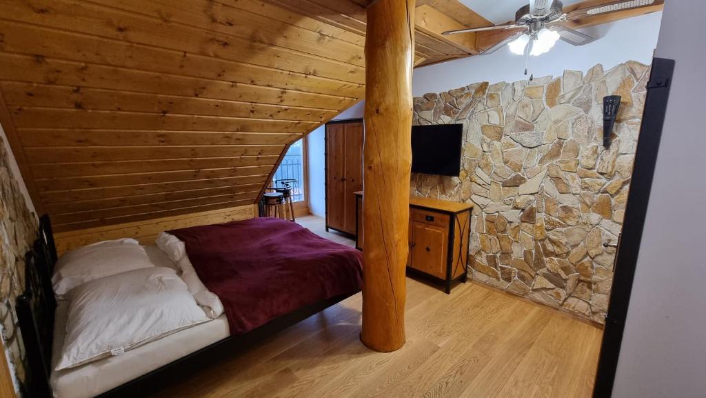 Postel nebo postele na pokoji v ubytování Penzion Srub Panorama