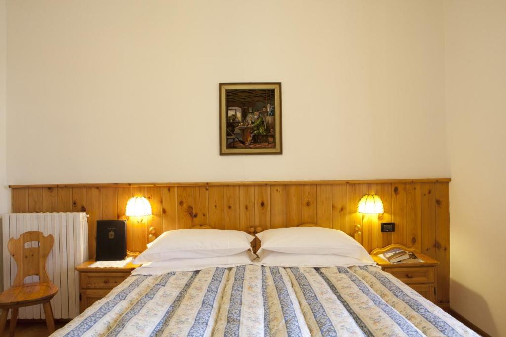 Posteľ alebo postele v izbe v ubytovaní Hotel Bellaria - Cortina d'Ampezzo