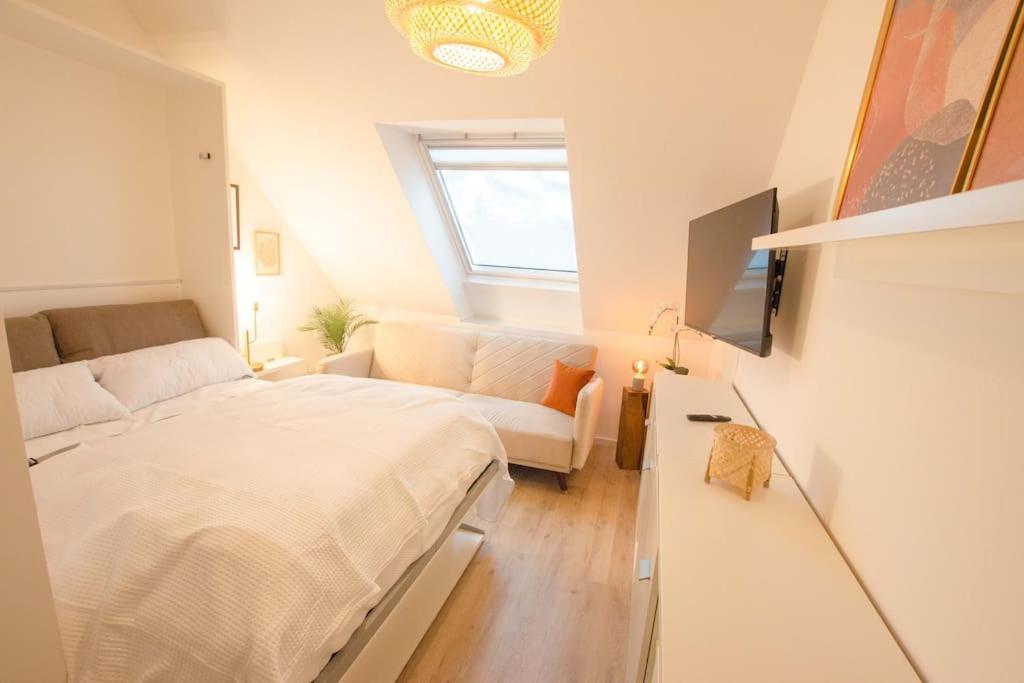 Säng eller sängar i ett rum på Gemütliches Apartment im Zentrum