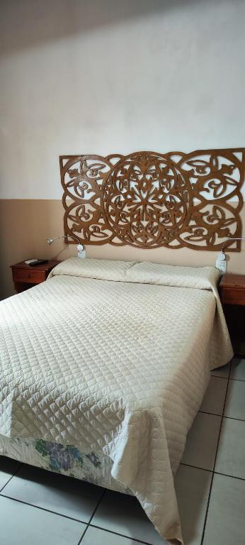 Postel nebo postele na pokoji v ubytování El Rosedal Cataratas