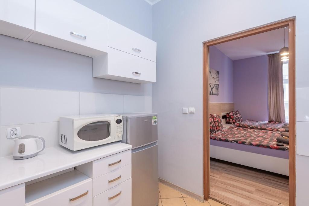 Posteľ alebo postele v izbe v ubytovaní Queen Apartments