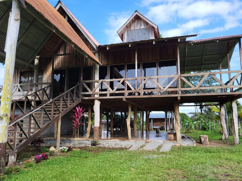 a large wooden house with a large deck at My Country House Paradise, Rio Celeste! in San Rafael
