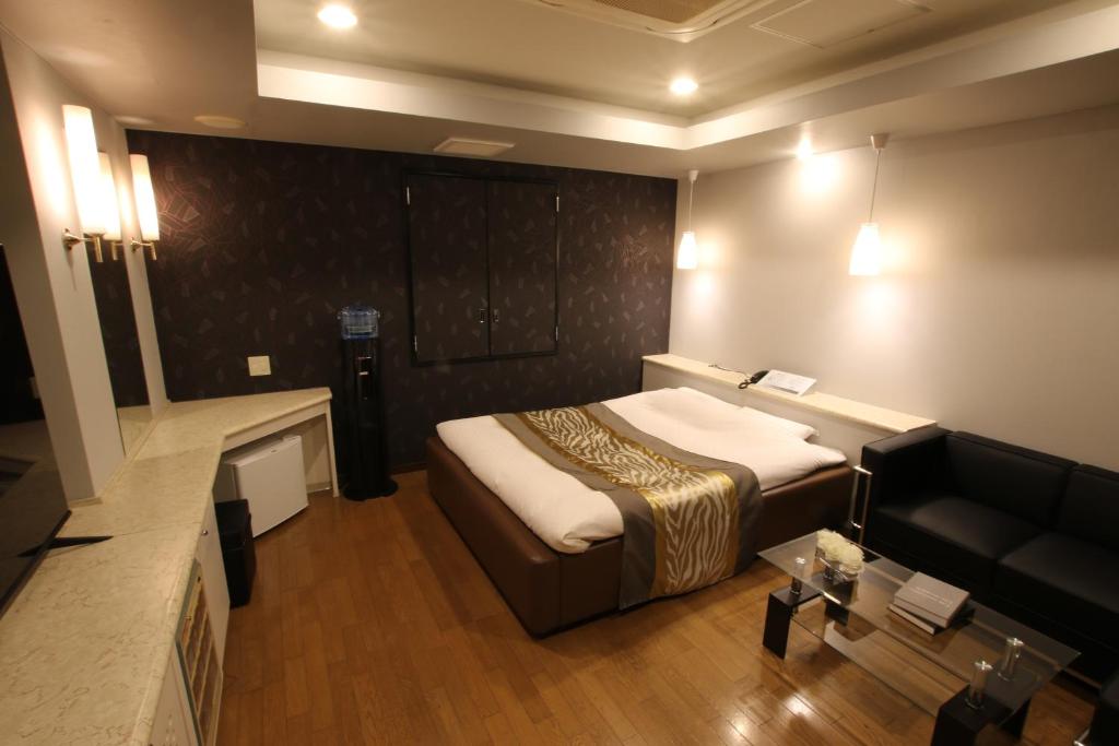 Postel nebo postele na pokoji v ubytování HOTEL K-WAVE Adult Only