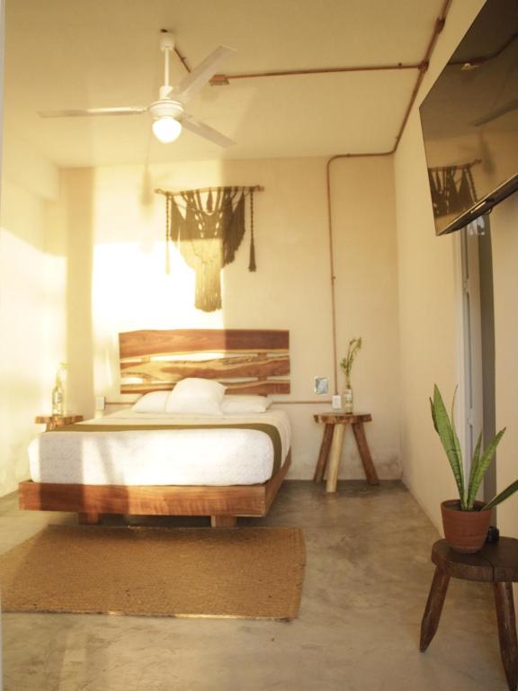 Postel nebo postele na pokoji v ubytování Tropic Bacalar