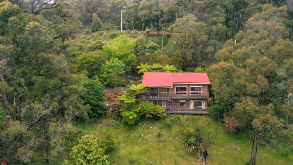 an aerial view of a house with a red roof at Embrace Nature's Beauty in Ferny Creek in Ferny Creek