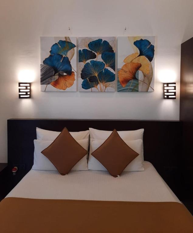 Postel nebo postele na pokoji v ubytování D Plus B&B Negombo