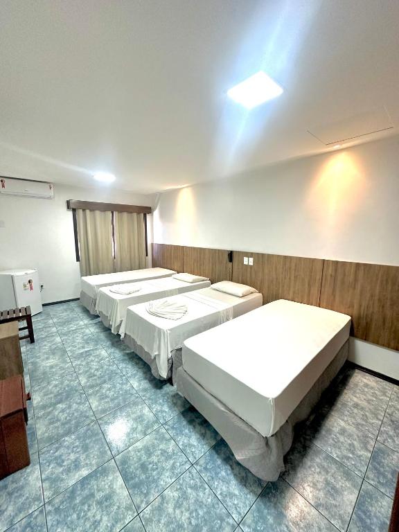 Cama ou camas em um quarto em Hotel Bem Brasil