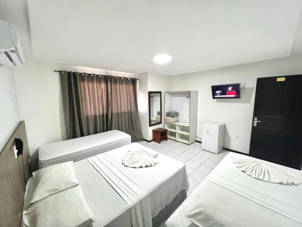 Cama ou camas em um quarto em Hotel Bem Brasil