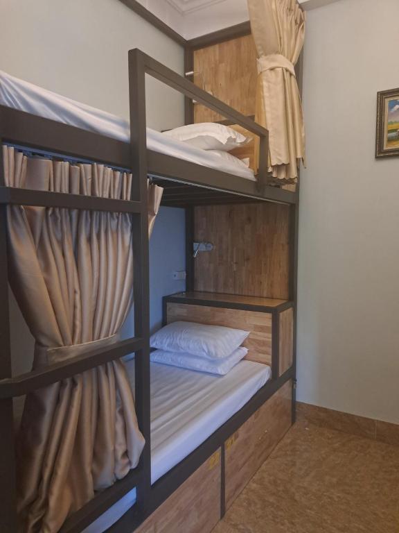 Postel nebo postele na pokoji v ubytování Tam Coc Guest House & Hostel