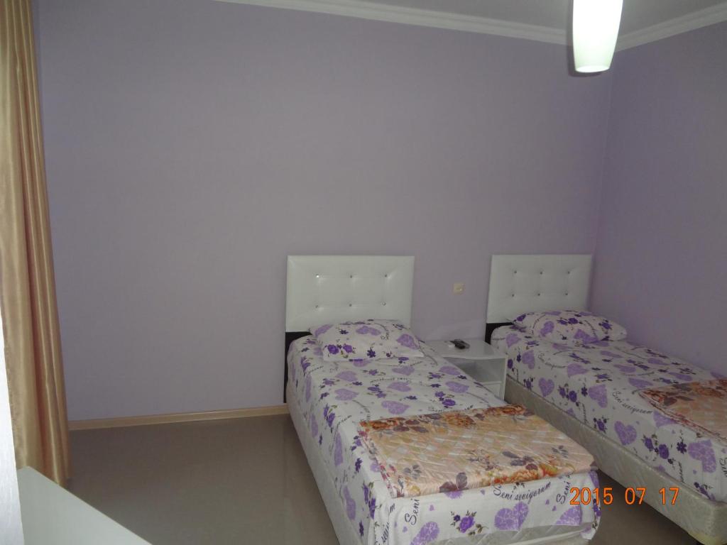 Postel nebo postele na pokoji v ubytování Twins Hotel
