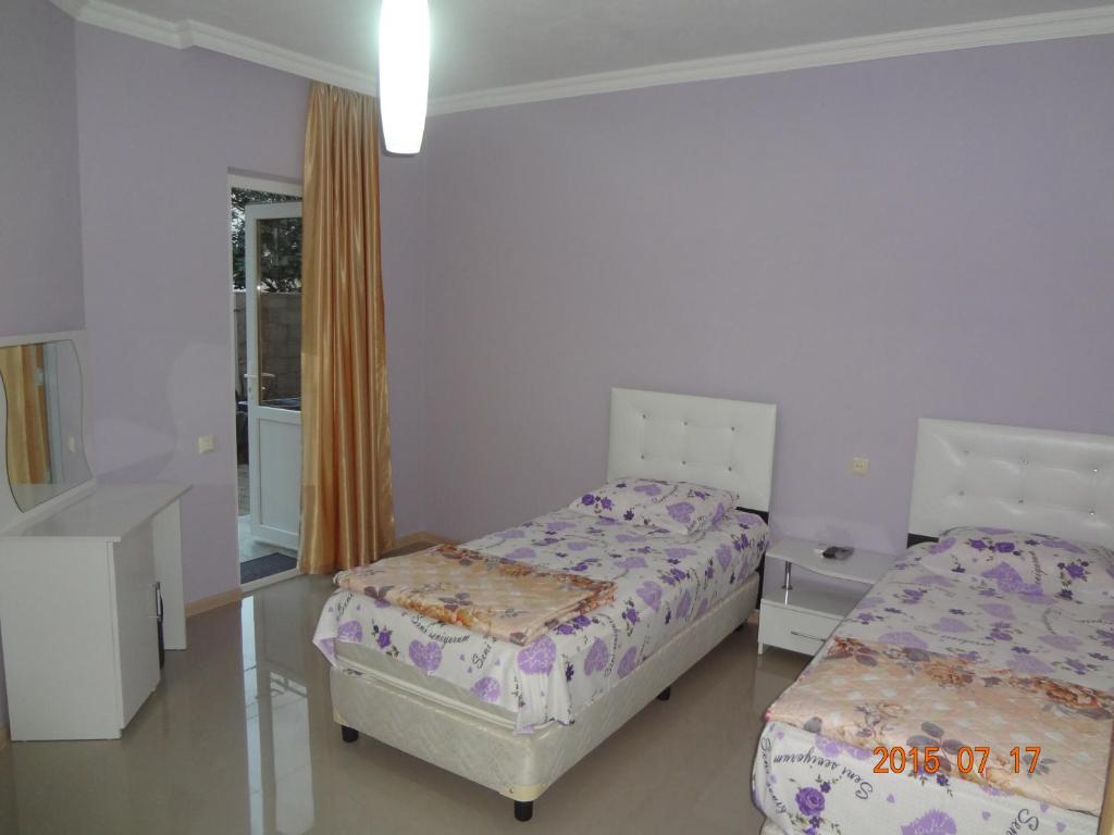 Postel nebo postele na pokoji v ubytování Twins Hotel