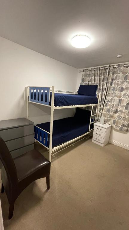 a room with two bunk beds and a chair at Female Room in Dublin