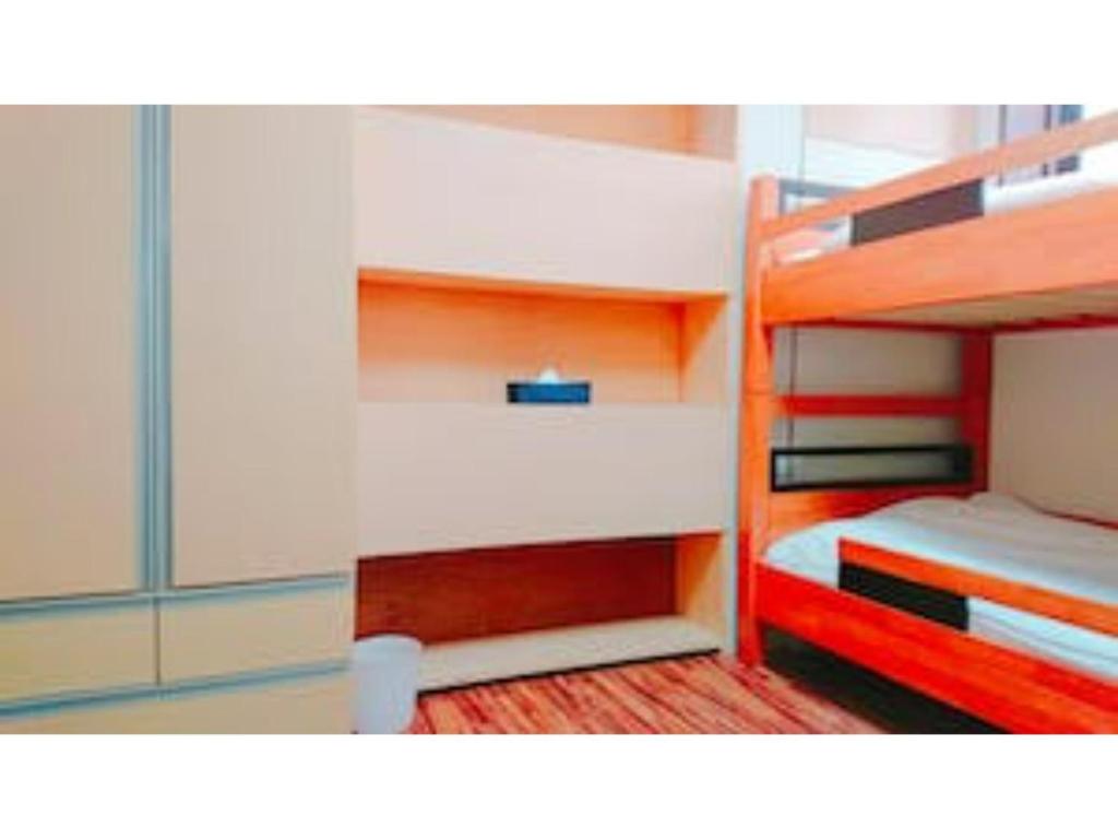 a room with two bunk beds with at The Stay Central Nagasaki / Vacation STAY 5111 in Nagasaki