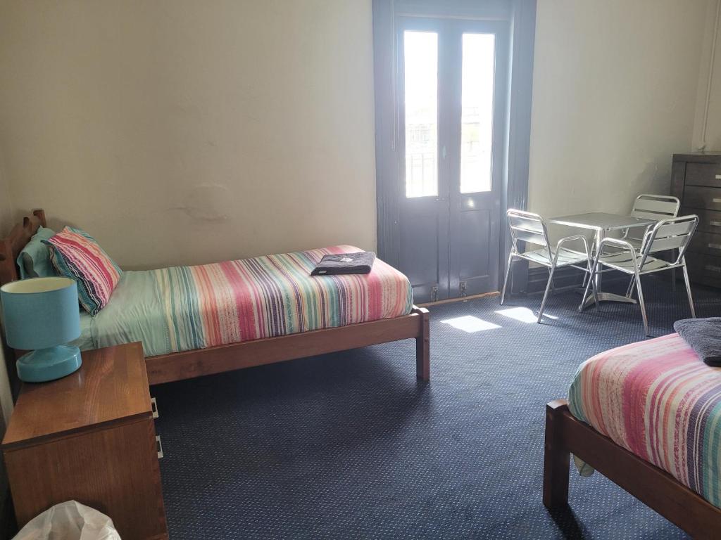 Postel nebo postele na pokoji v ubytování Australia Hotel Fremantle