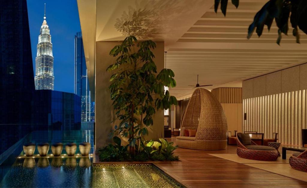 a hotel lobby with a view of the petronas towers at 1 Bedroom near KLCC, Jalan Kia Peng in Kuala Lumpur