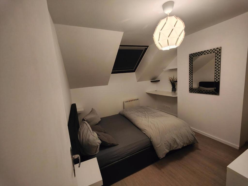 Postel nebo postele na pokoji v ubytování Les Lofts De Provins: Apt 8