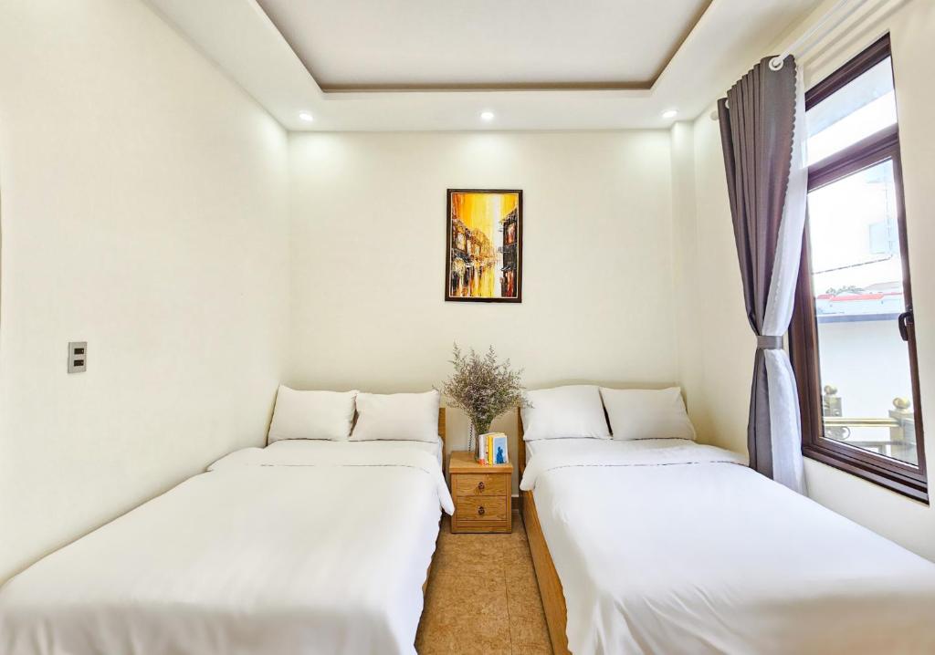 Giường trong phòng chung tại Mai DiaMond Hotel
