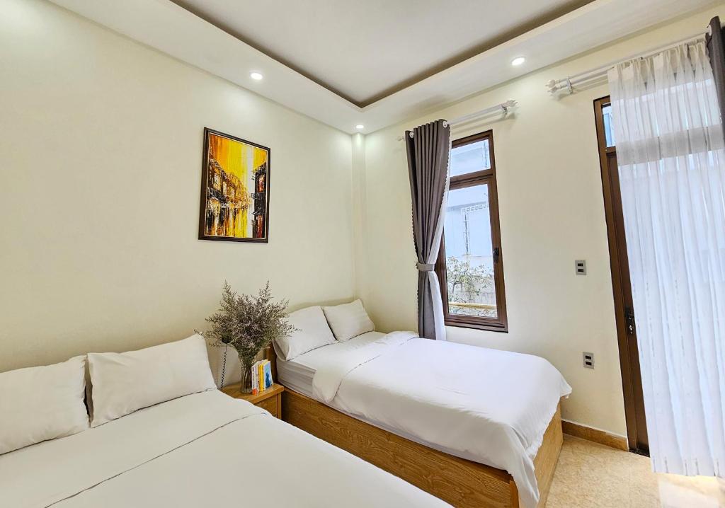 Giường trong phòng chung tại Mai DiaMond Hotel