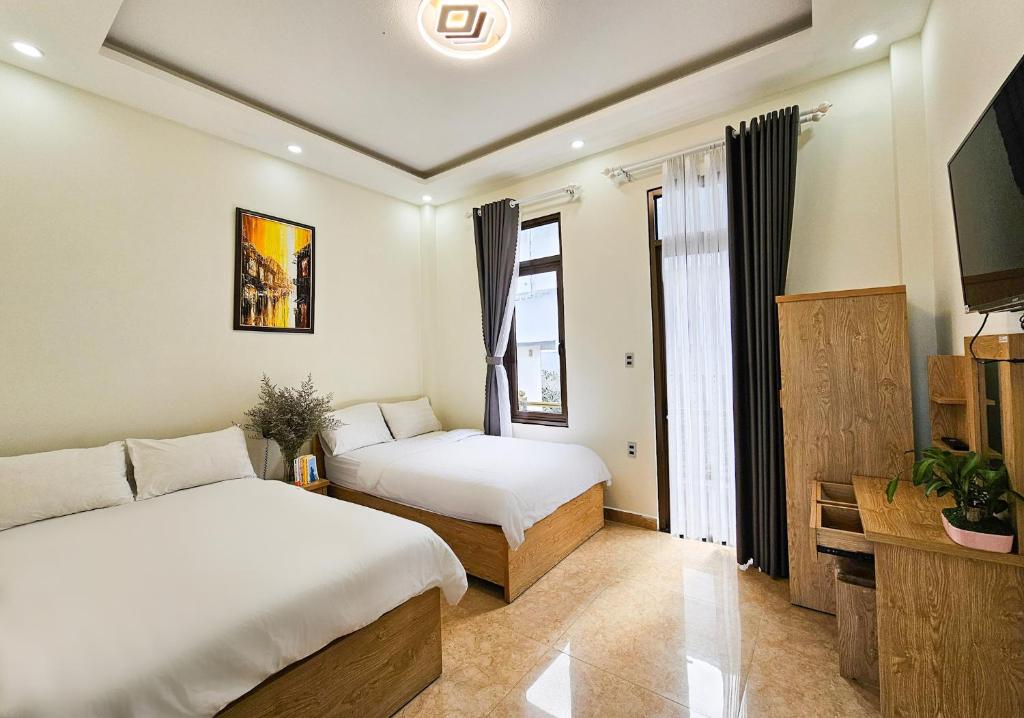 Giường trong phòng chung tại Mai DiaMond Hotel