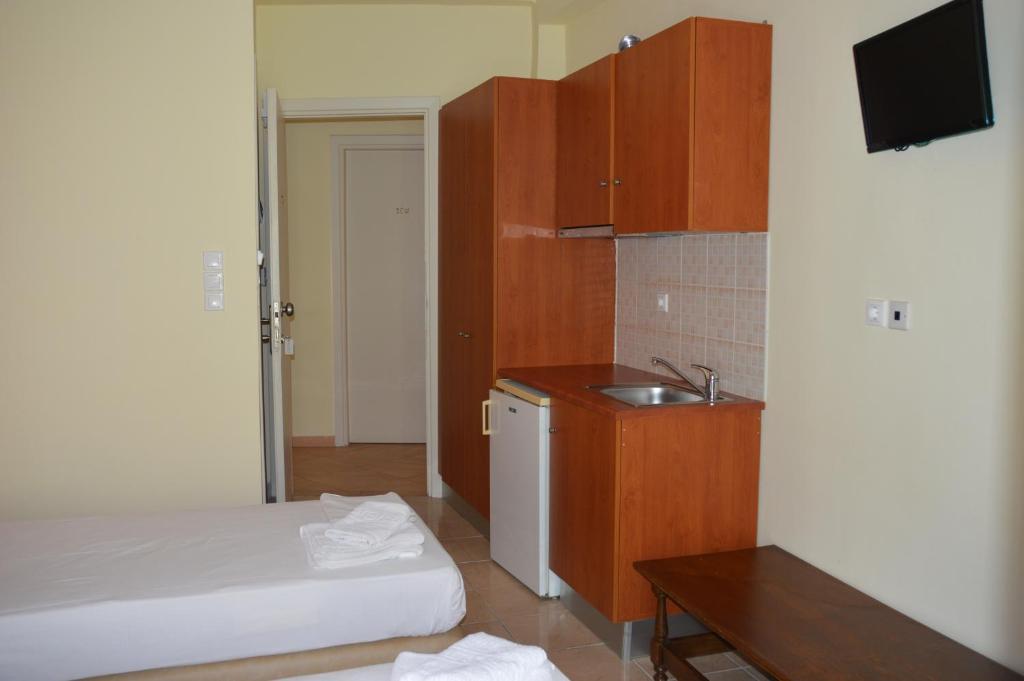 Postel nebo postele na pokoji v ubytování Marvi Hotel