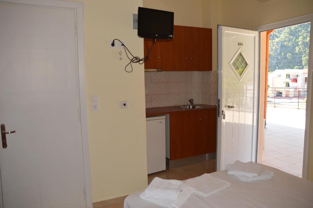 Kuchyň nebo kuchyňský kout v ubytování Marvi Hotel
