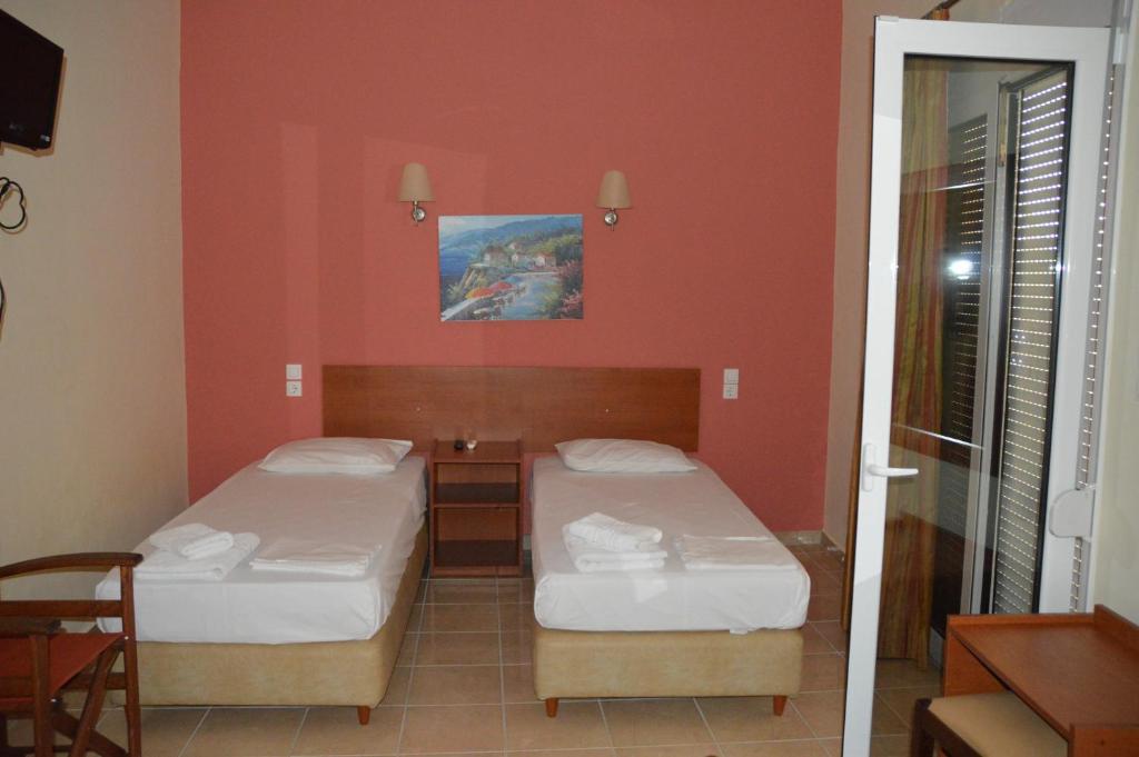 Postel nebo postele na pokoji v ubytování Marvi Hotel