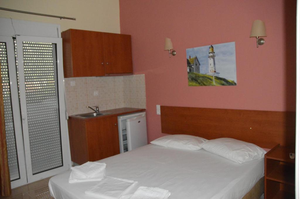 Postel nebo postele na pokoji v ubytování Marvi Hotel