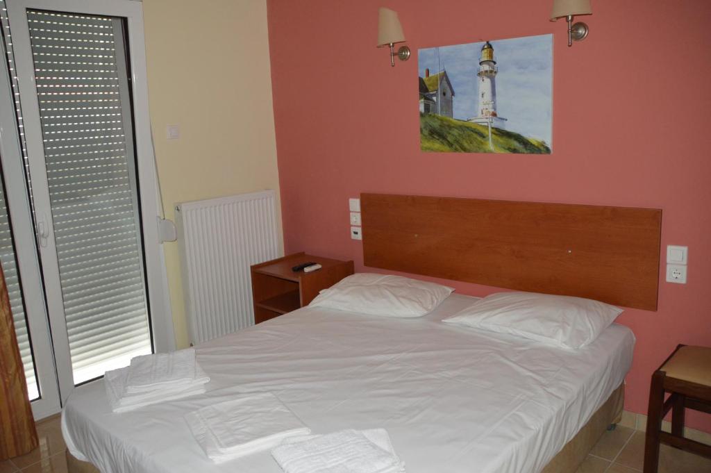 Postel nebo postele na pokoji v ubytování Marvi Hotel