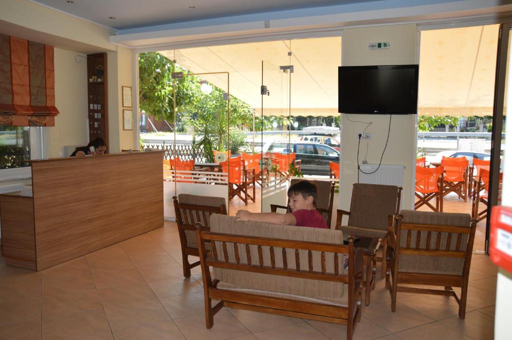 TV a/nebo společenská místnost v ubytování Marvi Hotel