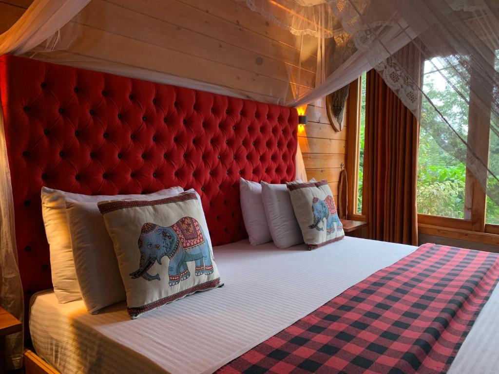 Postel nebo postele na pokoji v ubytování Mc Queen Homestay