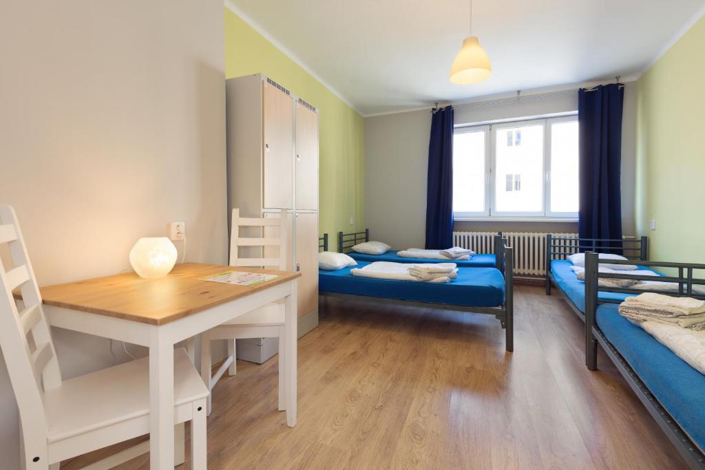 Postel nebo postele na pokoji v ubytování Patio Hostel Dorms