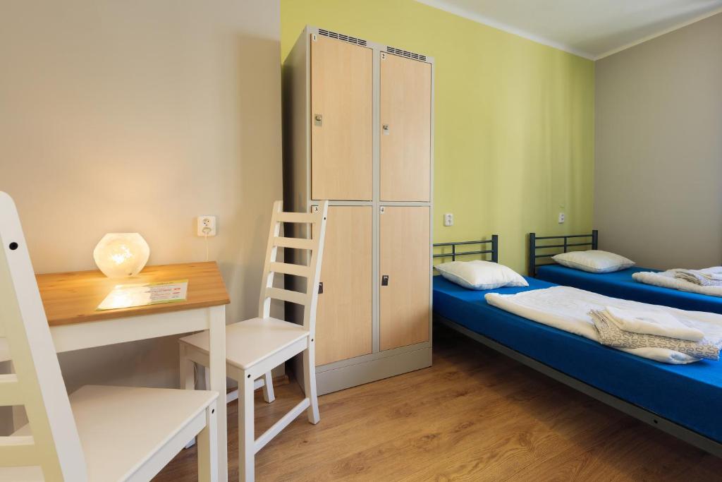 Postel nebo postele na pokoji v ubytování Patio Hostel Dorms