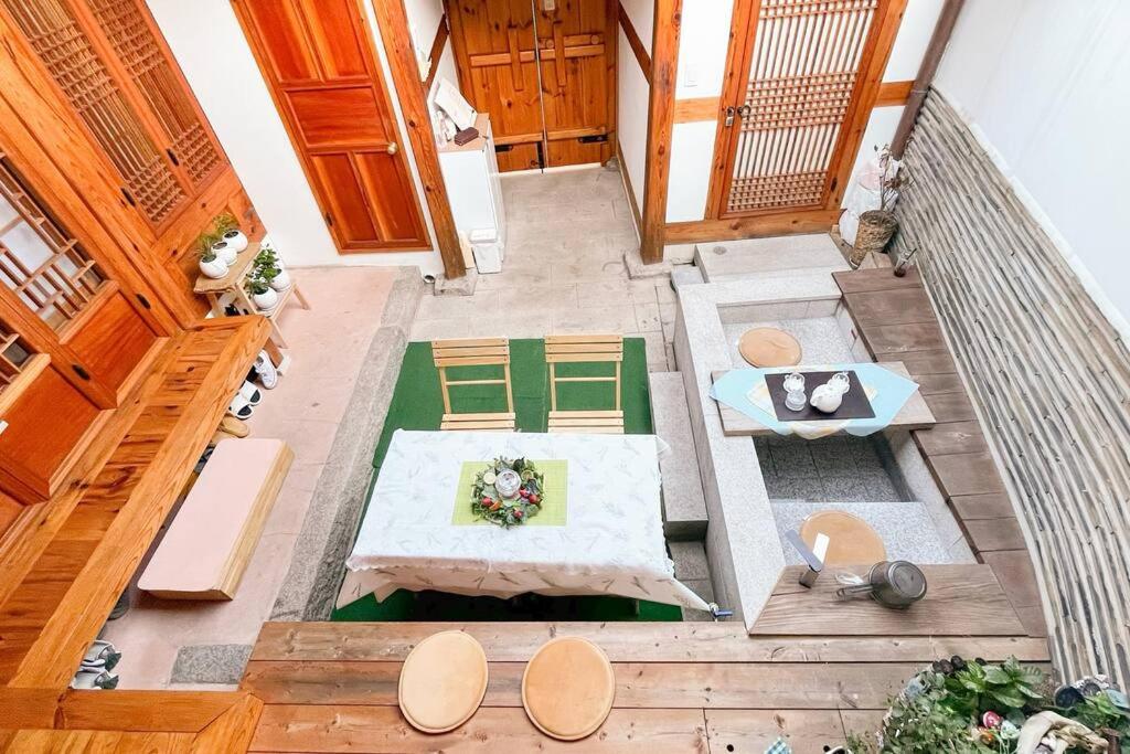an overhead view of a room with a table and chairs at Hwadong 1Beonji in Seoul