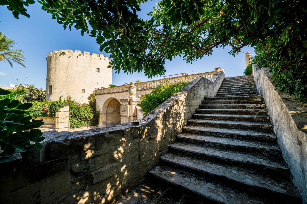 a set of stairs leading up to a castle at Torre Del Parco in Lecce