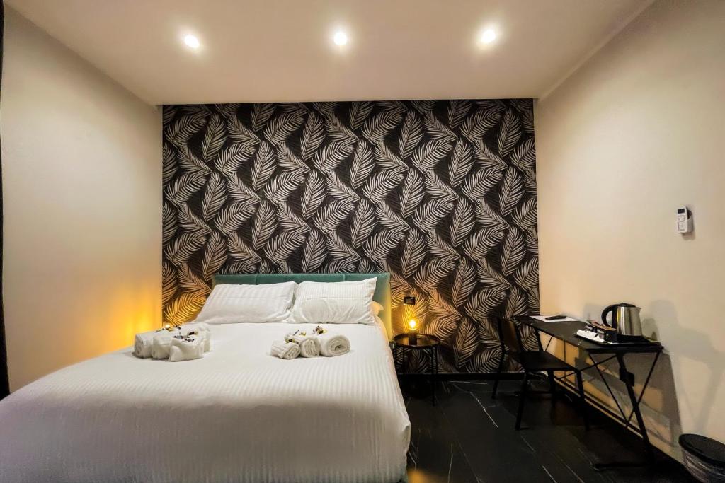 Postel nebo postele na pokoji v ubytování Le Colonne B&b