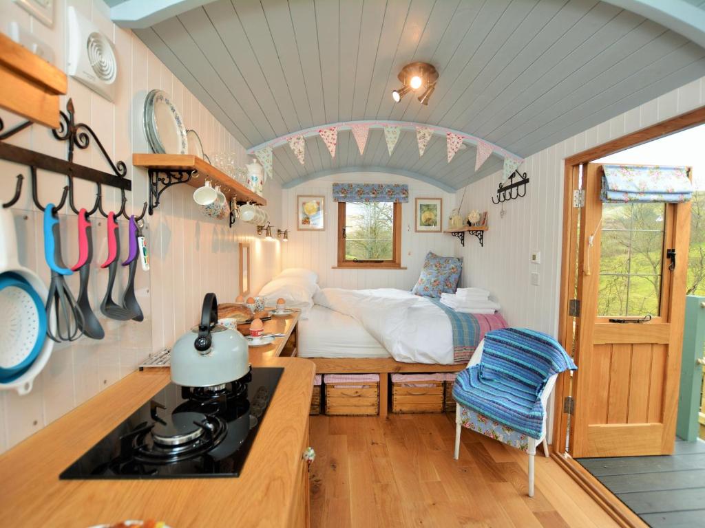a small kitchen with a bed in a tiny house at 1 Bed in Llanidloes 56492 in Van