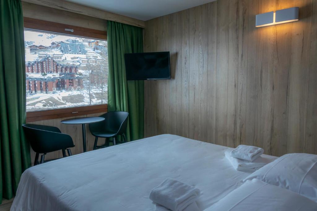 Postel nebo postele na pokoji v ubytování Hotel Petit Palais