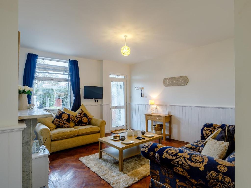 a living room with two couches and a coffee table at 1 bed in Paignton 78200 in Paignton