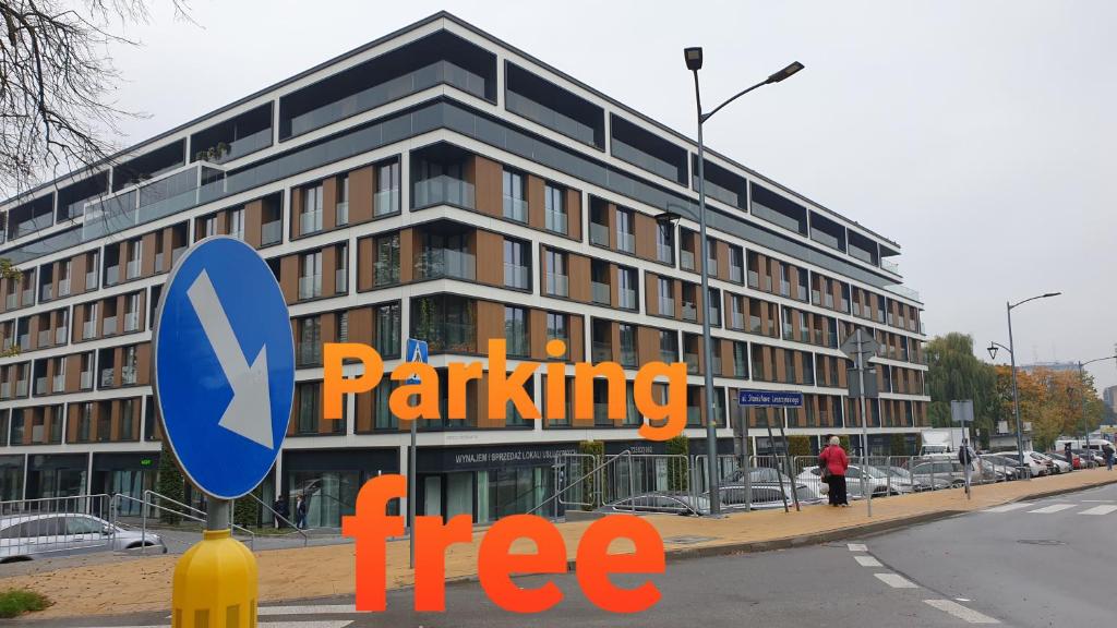 a building with an orange parking tree sign in front of it at Active Residence C 408 in Lublin