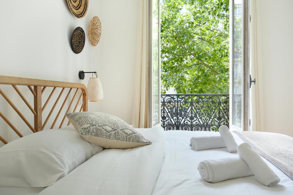 Llit o llits en una habitaci&oacute; de Apartment Center of Paris by Studio prestige