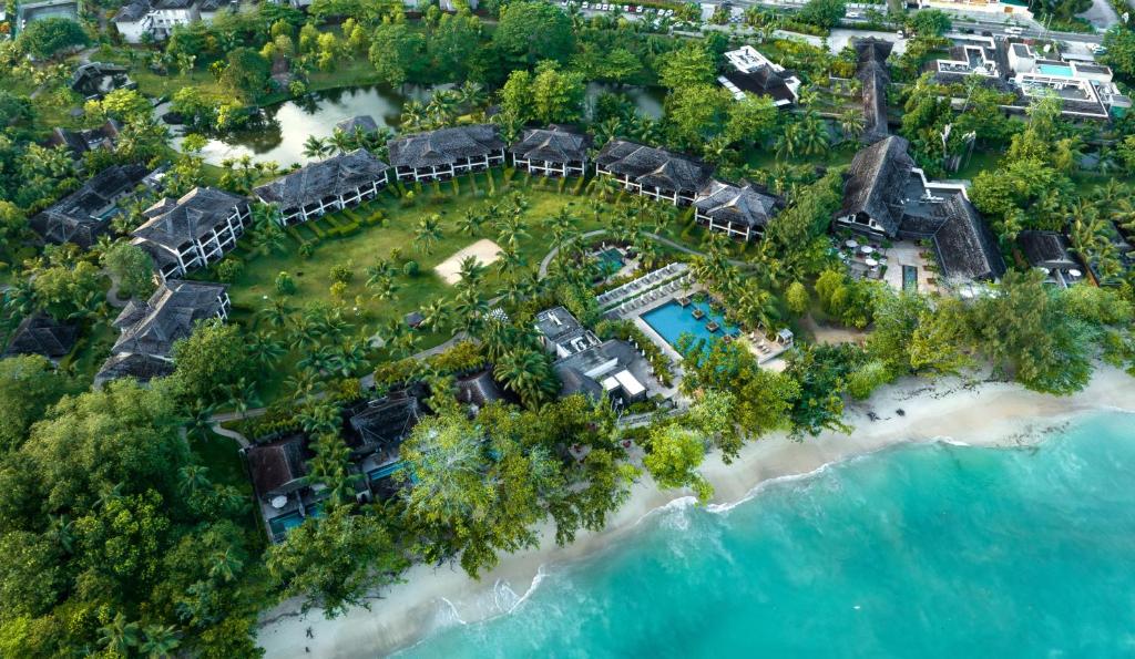 an aerial view of a resort on a beach at STORY Seychelles in Beau Vallon