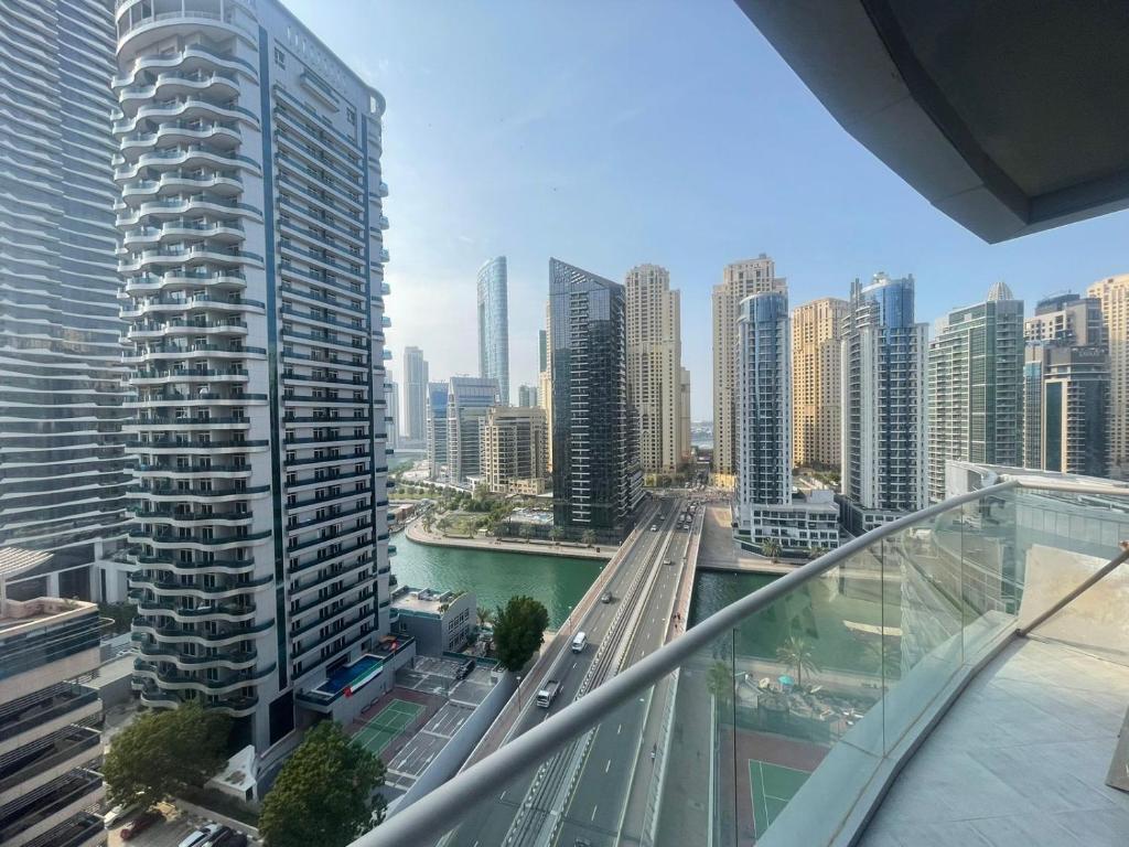 a view of a city from the balcony of a building at Luxury 2-bedroom & 3 bath Dubai Marina & JBR in Dubai
