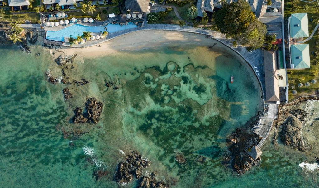 an aerial view of a beach and the ocean at Fisherman's Cove Resort in Bel Ombre