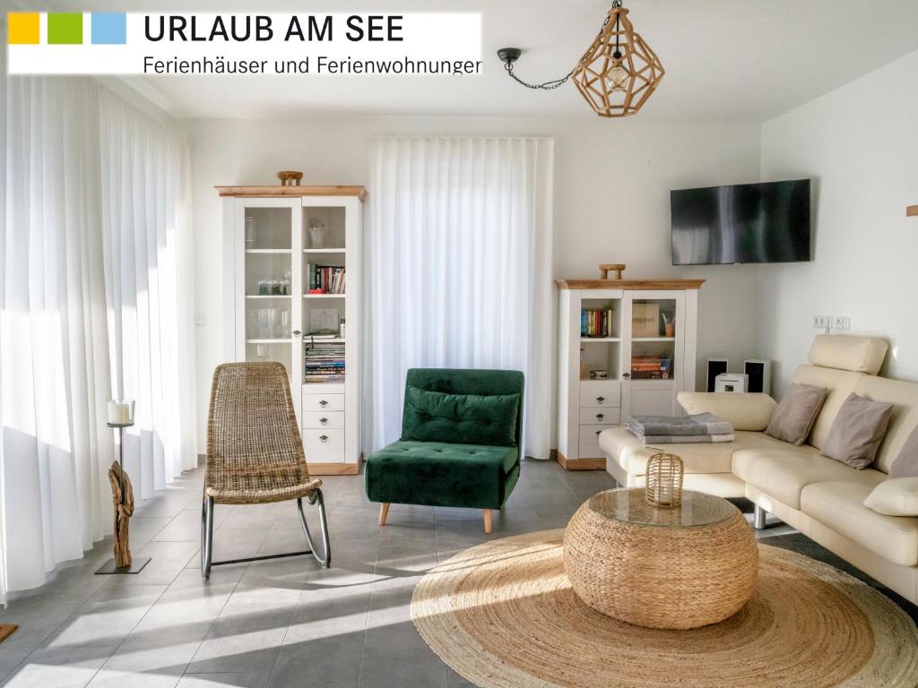 a living room with a couch and a table at Park-Apartment Scharmützelsee Wohnung 5 in Wendisch Rietz