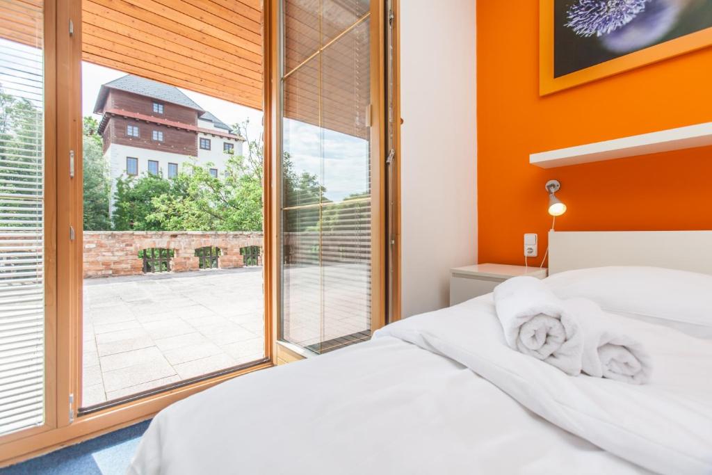 Postel nebo postele na pokoji v ubytování Hotelový dům Adina - Bed and Breakfast
