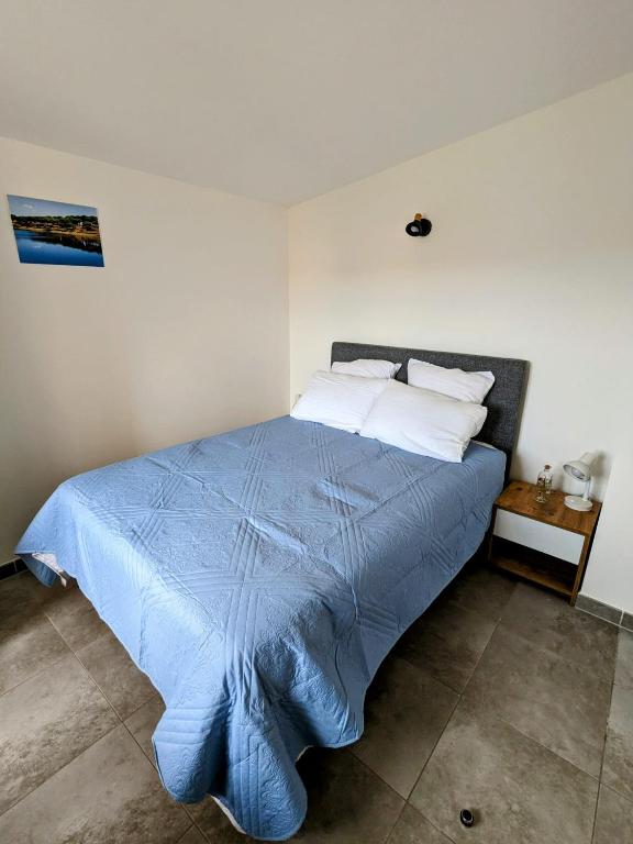 Posteľ alebo postele v izbe v ubytovaní Résidence hôtelière les hameaux de saint cyprien appartement 35 M2 1 chambre