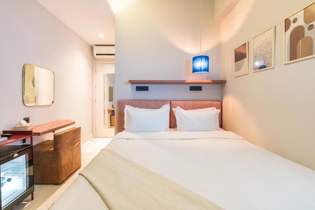 Postel nebo postele na pokoji v ubytování JEMAA EL FNA Suites & Spa