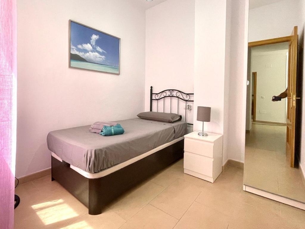 Posteľ alebo postele v izbe v ubytovaní Perita Apartments Malaga center and free parking