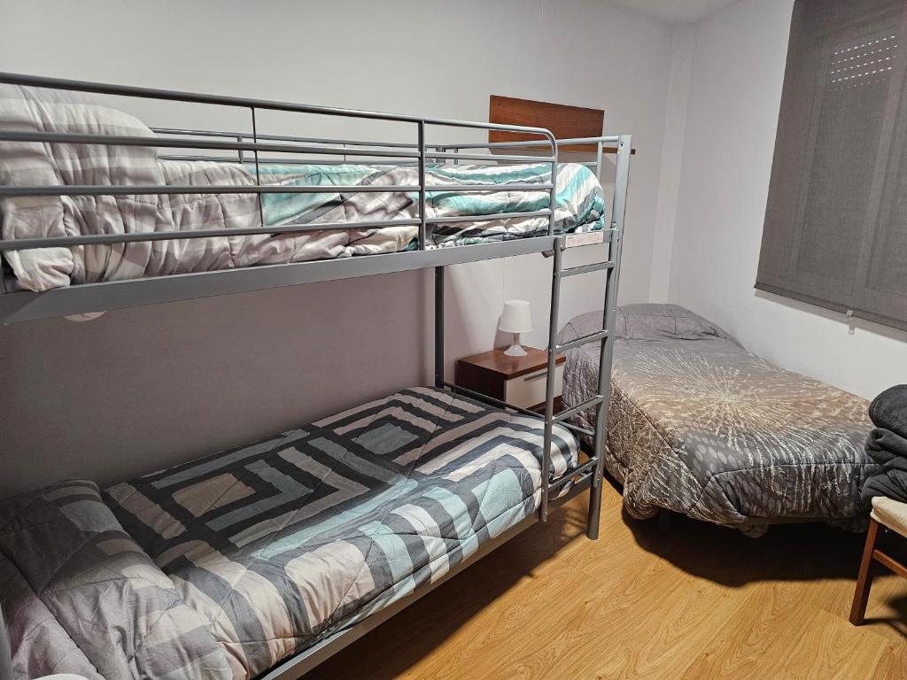 Posteľ alebo postele v izbe v ubytovaní Apartamento en Cuevas del Becerro