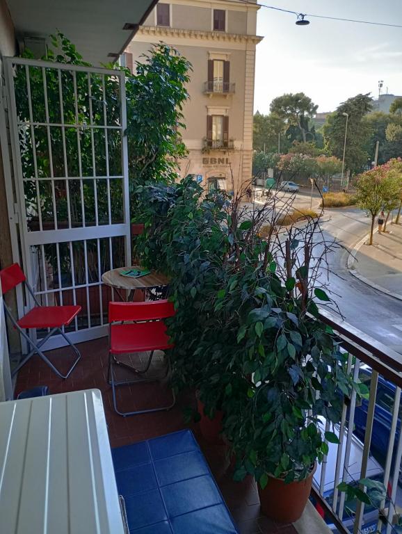 a balcony with a table and a potted plant at Casa Piacquadio in Bari